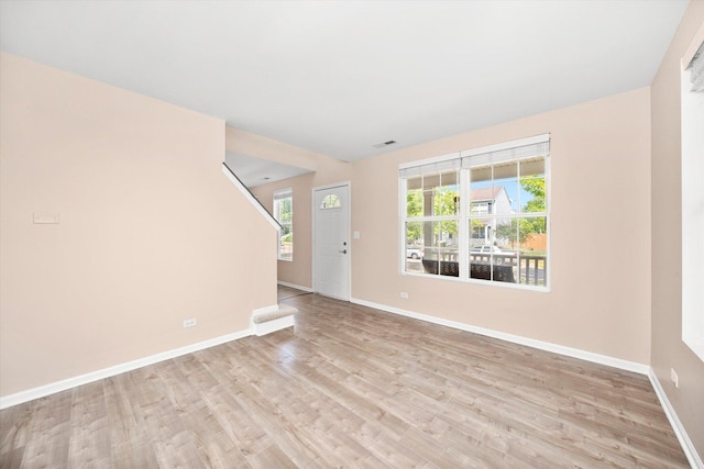 995 Serendipity Dr, Aurora, IL 60504 - unfurnished living room with baseboards and wood finished floors