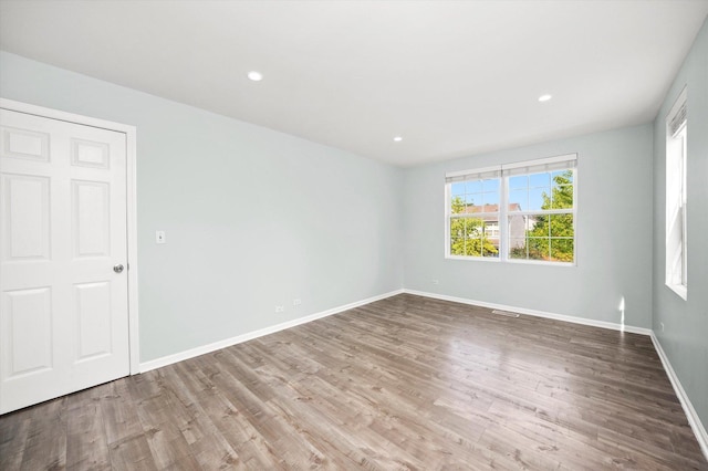 995 Serendipity Dr, Aurora, IL 60504 - empty room with wood finished floors and recessed lighting