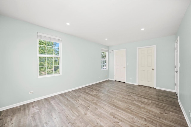 995 Serendipity Dr, Aurora, IL 60504 - unfurnished bedroom with wood finished floors and recessed lighting