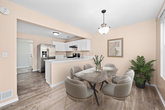995 Serendipity Dr, Aurora, IL 60504 - dining area with baseboards and light wood-style flooring