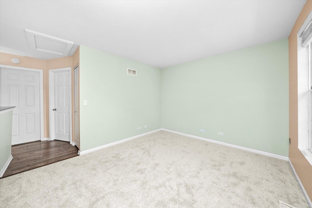 995 Serendipity Dr, Aurora, IL 60504 - carpeted empty room with baseboards and attic access