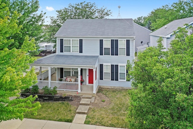 995 Serendipity Dr, Aurora, IL 60504 - view of front of house featuring covered porch, a front lawn, and roof with shingles