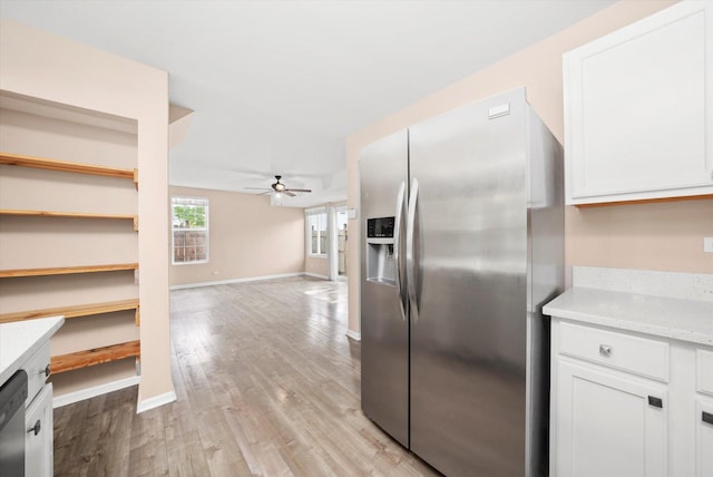 995 Serendipity Dr, Aurora, IL 60504 - kitchen featuring stainless steel appliances, ceiling fan, white cabinets, light wood finished floors, and open floor plan