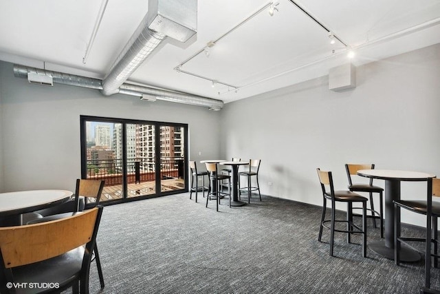 525 W Superior St Unit 224, Chicago, IL 60654 - carpeted dining space featuring track lighting