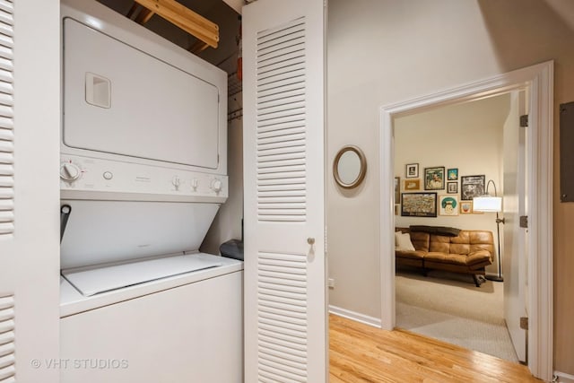 525 W Superior St Unit 224, Chicago, IL 60654 - laundry room with stacked washer / drying machine and light wood-style flooring