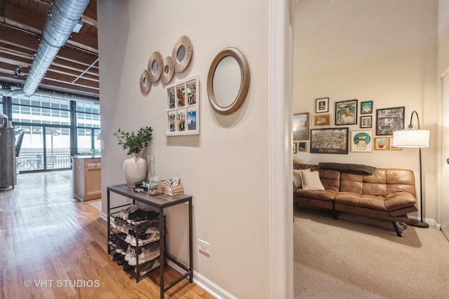 525 W Superior St Unit 224, Chicago, IL 60654 - hallway with a wall of windows and wood finished floors