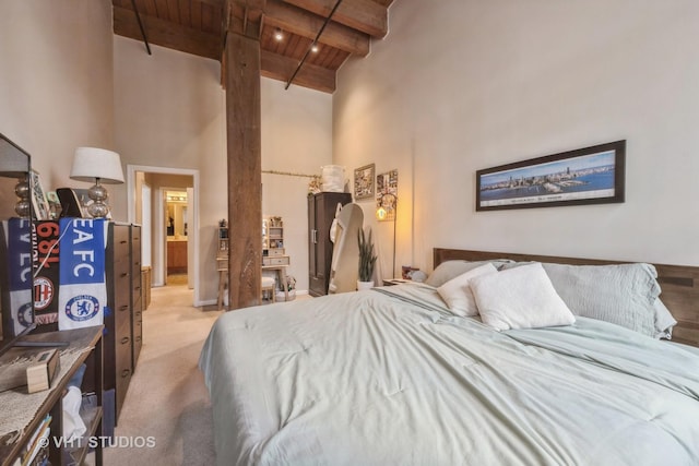 525 W Superior St Unit 224, Chicago, IL 60654 - bedroom featuring a wooden ceiling with exposed beams, high vaulted ceiling, and light colored carpet