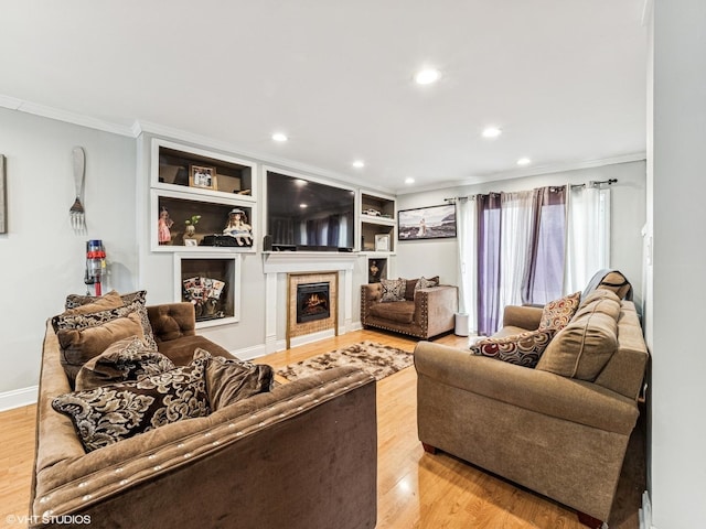665 Cindy Ln, Wheeling, IL 60090 - living room with ornamental molding, a lit fireplace, light wood finished floors, and recessed lighting