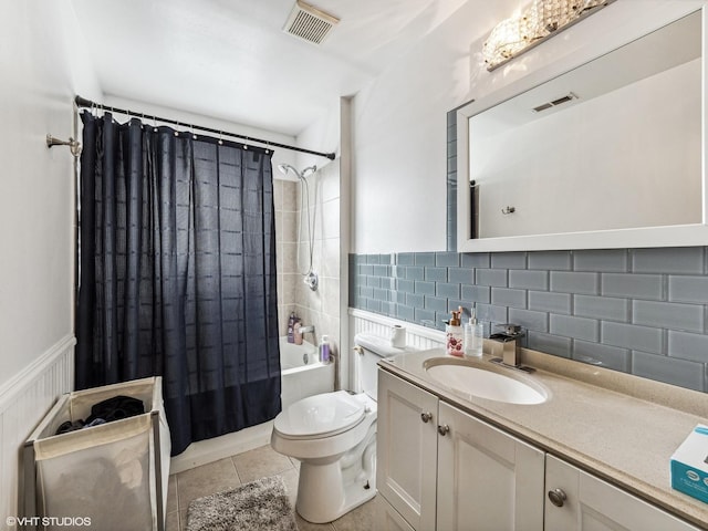 665 Cindy Ln, Wheeling, IL 60090 - bathroom featuring shower / tub combo with curtain, vanity, tile patterned floors, decorative backsplash, and wainscoting