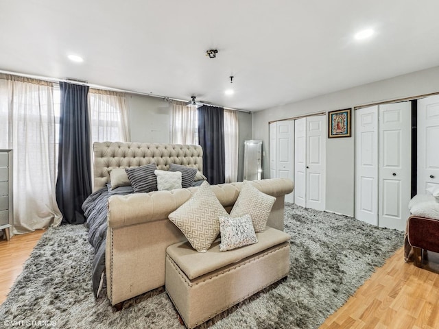 665 Cindy Ln, Wheeling, IL 60090 - bedroom featuring multiple closets, wood finished floors, and recessed lighting