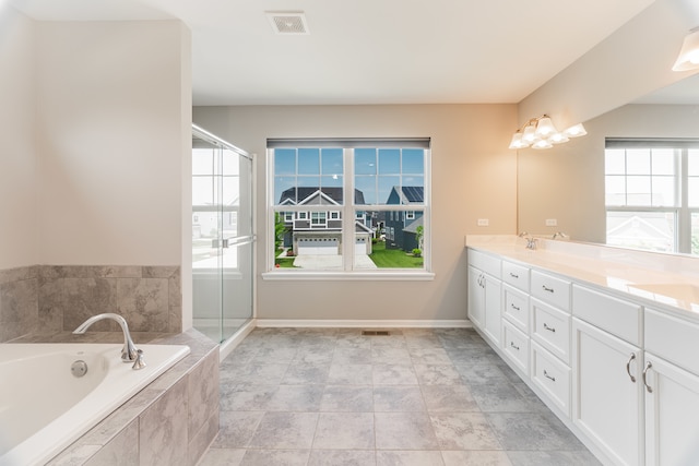 241 Stonington Dr, Bloomingdale, IL 60108 - bathroom with double vanity, a garden tub, and a shower with door