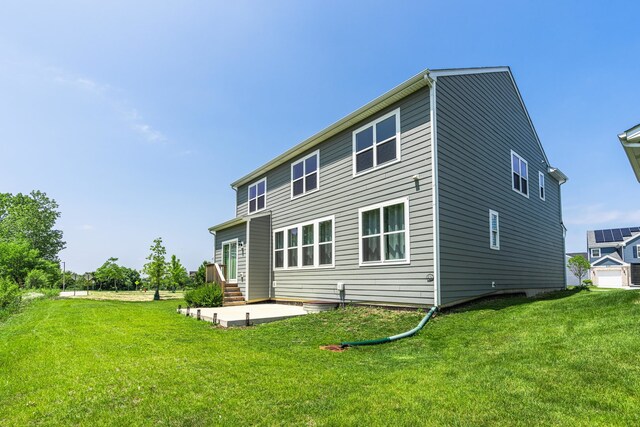 241 Stonington Dr, Bloomingdale, IL 60108 - back of house with a patio, a yard, and entry steps