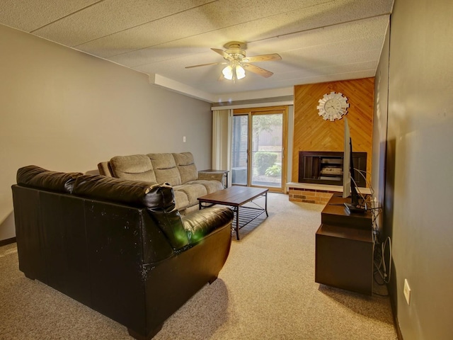 14624 Scarborough Ct S Unit G-1, Oak Forest, IL 60452 - living area featuring carpet flooring, a ceiling fan, wooden walls, and a fireplace with raised hearth