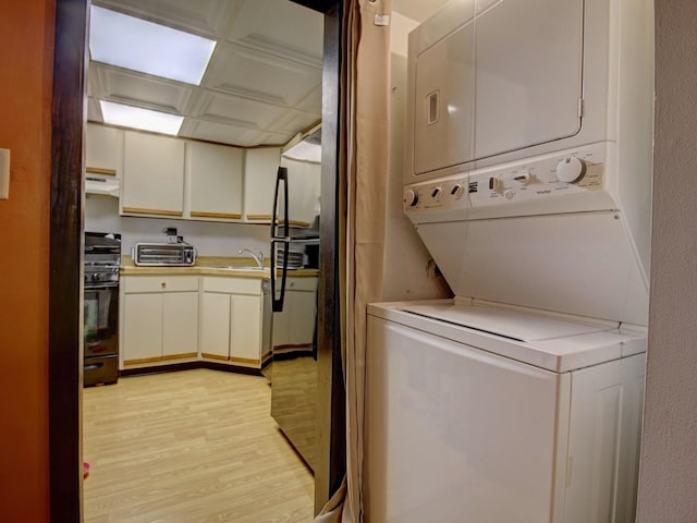 14624 Scarborough Ct S Unit G-1, Oak Forest, IL 60452 - laundry room with estacked washer and dryer and light wood finished floors