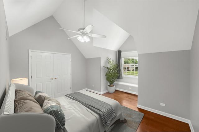 100 Homestead Dr, Wood Dale, IL 60191 - bedroom featuring vaulted ceiling, wood finished floors, ceiling fan, and a closet