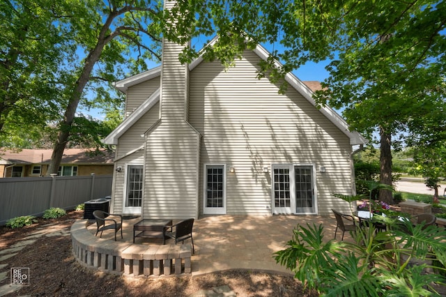 100 Homestead Dr, Wood Dale, IL 60191 - back of property with a patio area and a chimney