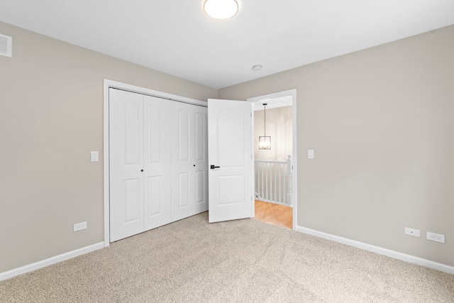 341 Tanager Dr, Woodstock, IL 60098 - unfurnished bedroom featuring carpet flooring and a closet