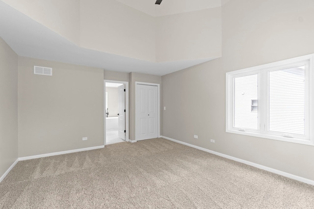 341 Tanager Dr, Woodstock, IL 60098 - carpeted spare room with a towering ceiling and ceiling fan