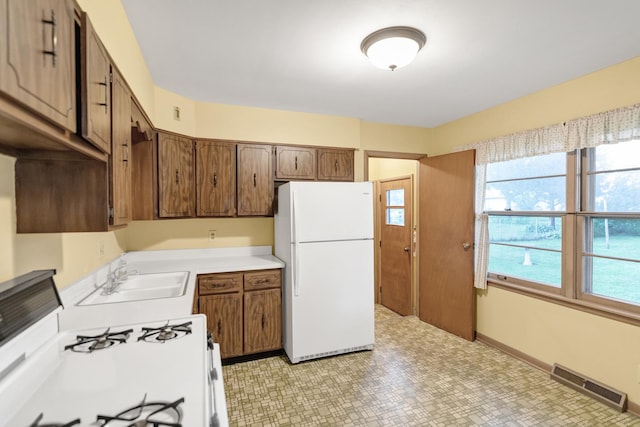 301 Virginia Dr, South Elgin, IL 60177 - kitchen featuring white appliances, light countertops, and light floors