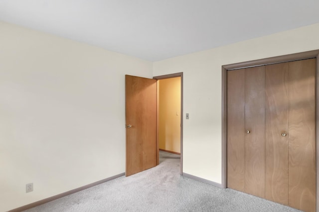 301 Virginia Dr, South Elgin, IL 60177 - unfurnished bedroom featuring light carpet and a closet