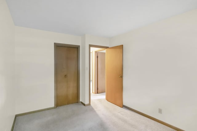 301 Virginia Dr, South Elgin, IL 60177 - unfurnished bedroom with light carpet and a closet