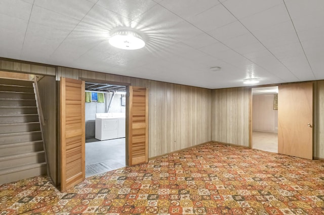 301 Virginia Dr, South Elgin, IL 60177 - basement with washing machine and clothes dryer, wooden walls, and stairs