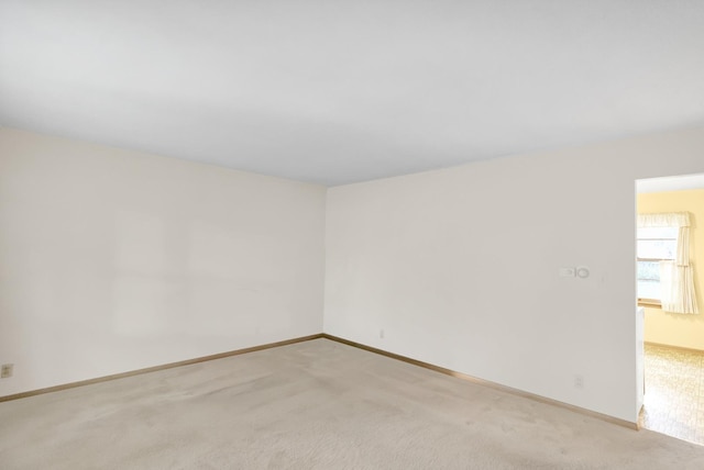 301 Virginia Dr, South Elgin, IL 60177 - spare room featuring light carpet and baseboards