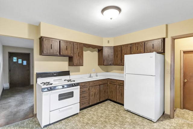 301 Virginia Dr, South Elgin, IL 60177 - kitchen with white appliances, light countertops, and dark brown cabinetry
