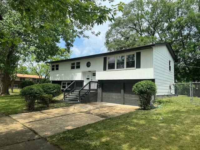 1813 218th Pl, Sauk Village, IL 60411 - raised ranch featuring an attached garage and concrete driveway