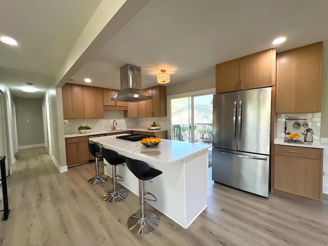 1813 218th Pl, Sauk Village, IL 60411 - kitchen featuring freestanding refrigerator, extractor fan, light wood-style floors, decorative backsplash, and recessed lighting