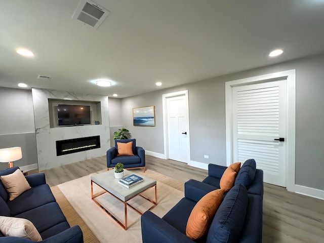1813 218th Pl, Sauk Village, IL 60411 - living room with wood finished floors, a fireplace, and recessed lighting