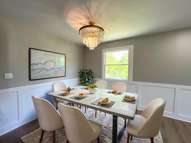 1813 218th Pl, Sauk Village, IL 60411 - dining room featuring a chandelier, a decorative wall, wainscoting, and wood finished floors