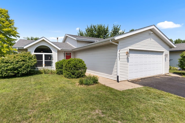 963 S Trainer Rd, Rockford, IL 61108 - view of front of house with an attached garage, driveway, a front yard, and a shingled roof