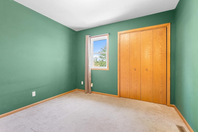 963 S Trainer Rd, Rockford, IL 61108 - unfurnished bedroom featuring carpet flooring and a closet