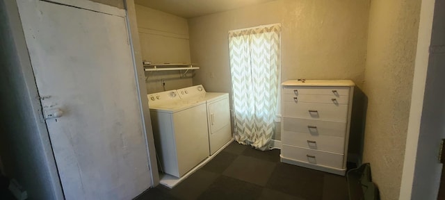 109 S 6th Ave, Sterling, IL 61081 - laundry room featuring separate washer and dryer, a textured wall, and dark flooring