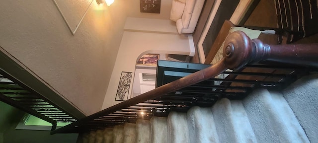 109 S 6th Ave, Sterling, IL 61081 - stairway featuring a textured wall and wood finished floors