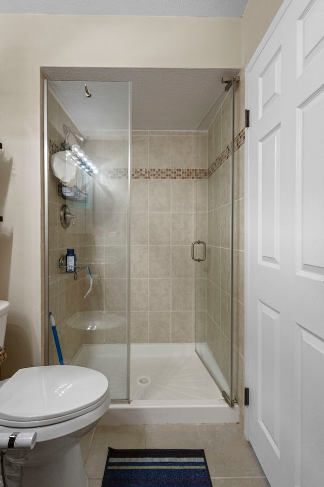 1777 W Crystal Ln Unit 711, Mount Prospect, IL 60056 - bathroom featuring tile patterned floors and a stall shower