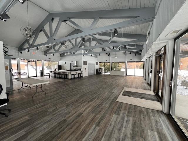 1777 W Crystal Ln Unit 711, Mount Prospect, IL 60056 - misc room with high vaulted ceiling, wood finished floors, healthy amount of natural light, and beam ceiling