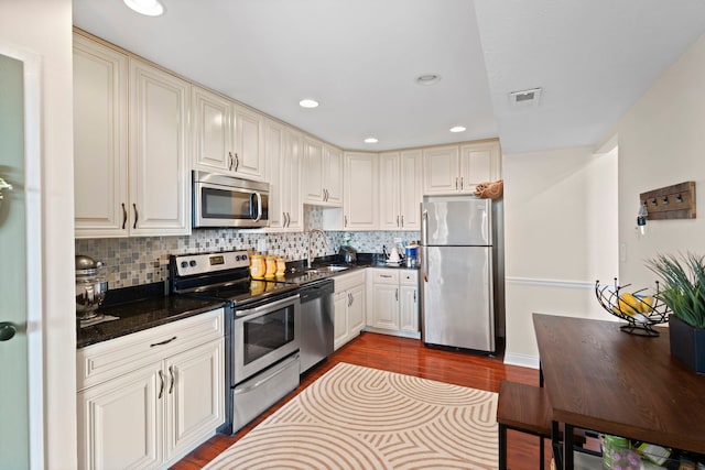 1777 W Crystal Ln Unit 711, Mount Prospect, IL 60056 - kitchen featuring appliances with stainless steel finishes, dark wood-type flooring, backsplash, and recessed lighting