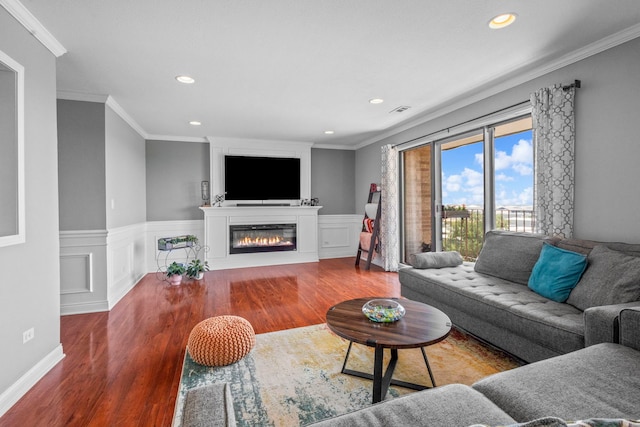 1777 W Crystal Ln Unit 711, Mount Prospect, IL 60056 - living area with recessed lighting, wood finished floors, wainscoting, crown molding, and a glass covered fireplace