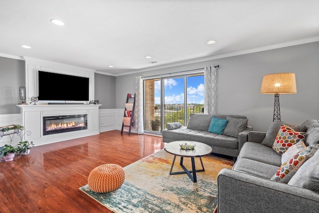 1777 W Crystal Ln Unit 711, Mount Prospect, IL 60056 - living area featuring ornamental molding, wood finished floors, recessed lighting, wainscoting, and a glass covered fireplace