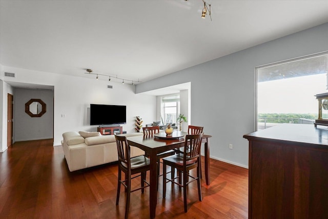 301 N Neil St Unit 609, Champaign, IL 61820 - dining area with track lighting and dark wood-type flooring