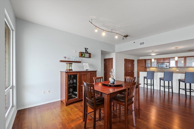 301 N Neil St Unit 609, Champaign, IL 61820 - dining area with dark wood finished floors and rail lighting