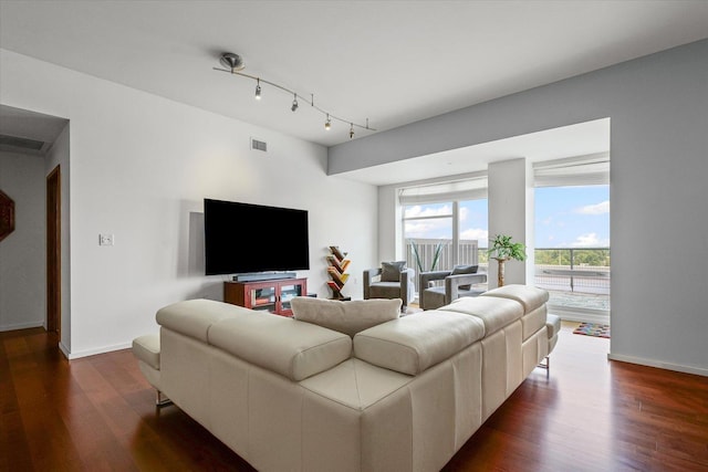 301 N Neil St Unit 609, Champaign, IL 61820 - living room featuring dark wood finished floors and track lighting
