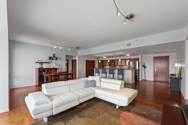 301 N Neil St Unit 609, Champaign, IL 61820 - living area with rail lighting and dark wood-type flooring