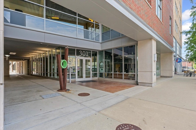 301 N Neil St Unit 609, Champaign, IL 61820 - view of exterior entry with brick siding