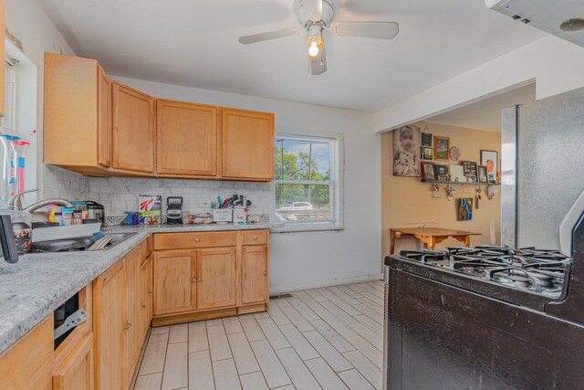 7900 S 86th Ct, Justice, IL 60458 - kitchen with decorative backsplash, light countertops, a ceiling fan, gas stove, and light brown cabinetry