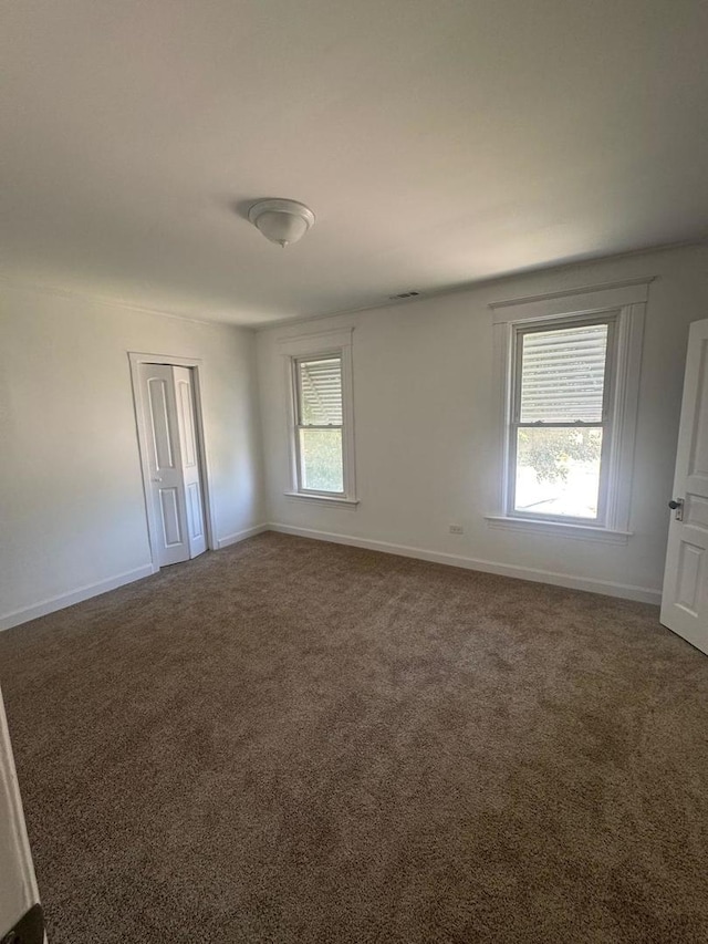 14040 Lincoln Ave, Dolton, IL 60419 - unfurnished room with carpet flooring and baseboards