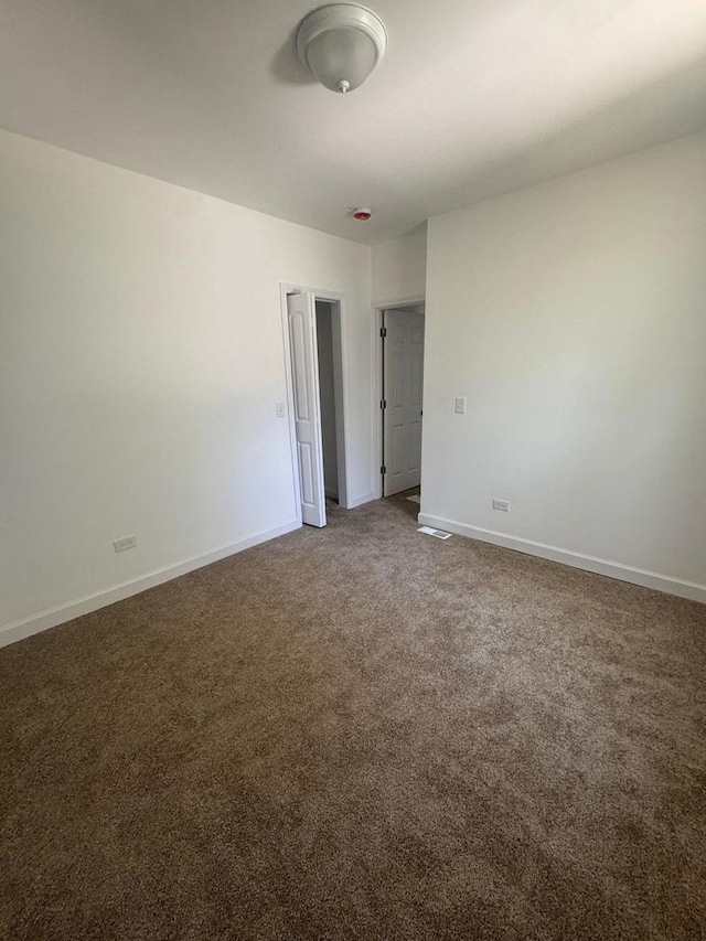 14040 Lincoln Ave, Dolton, IL 60419 - carpeted empty room with baseboards
