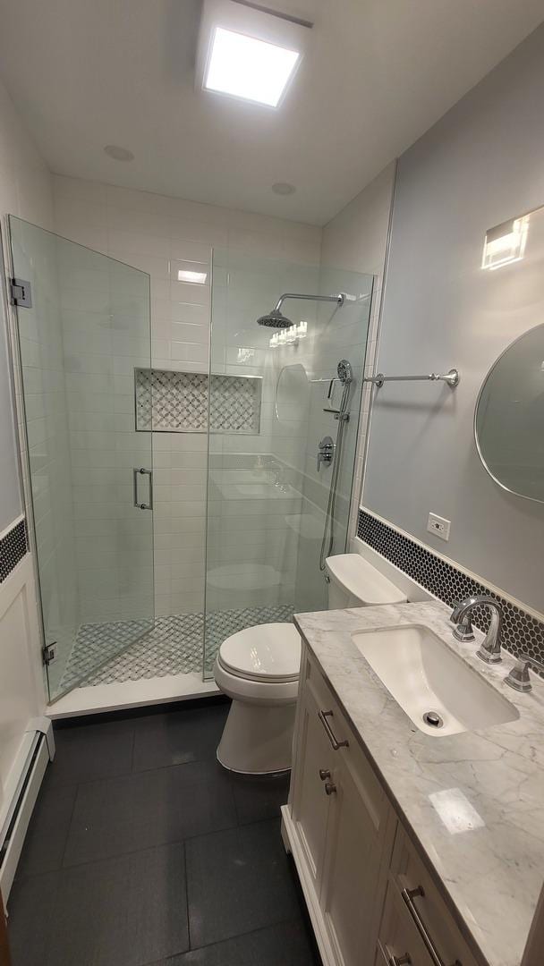 5448 W Agatite Ave, Chicago, IL 60630 - full bathroom featuring vanity, tile patterned flooring, a shower stall, and a baseboard radiator
